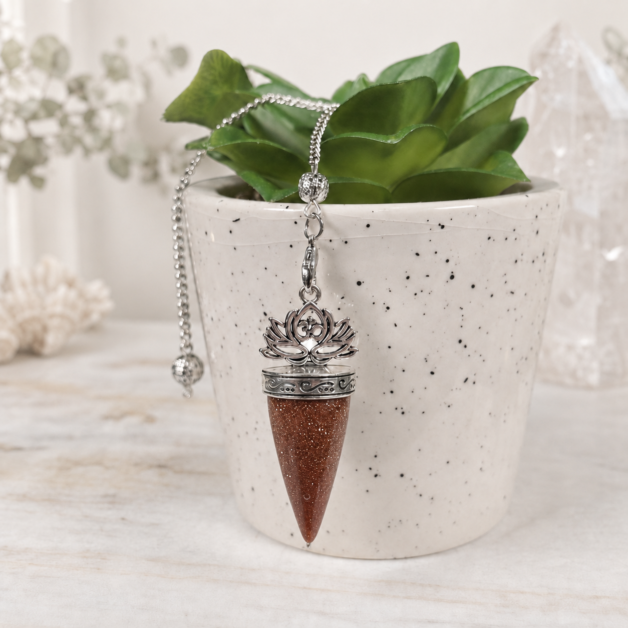 Goldstone Lotus Om Pendulum